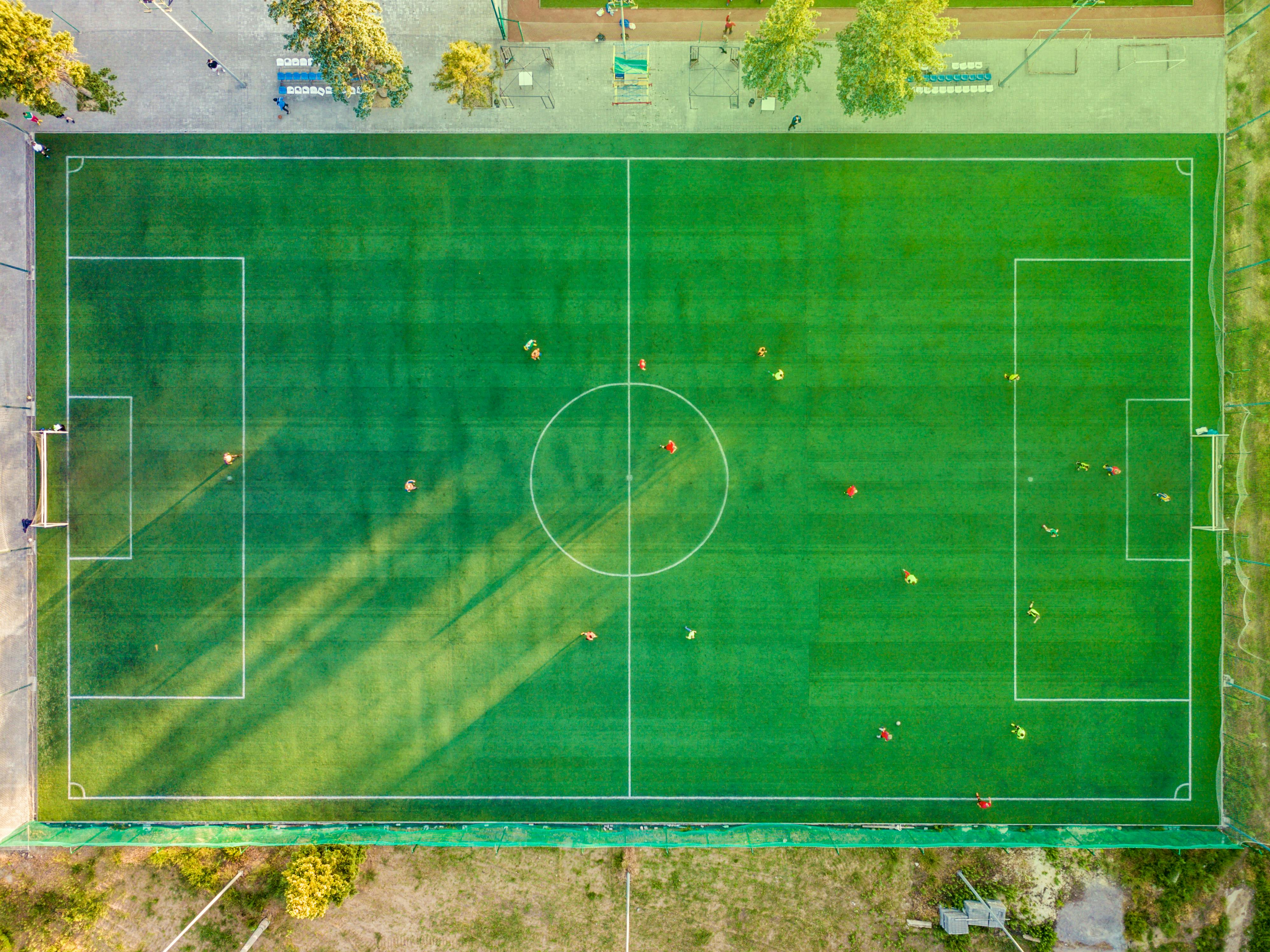 Aerial view of a football pitch with players in action